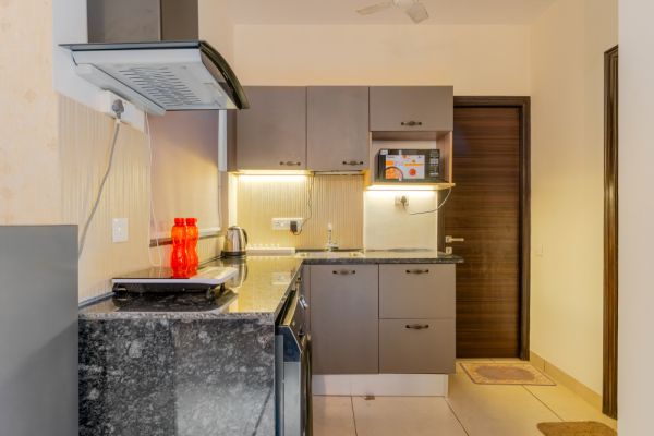 Sereno Pebbles 1 - cosy 1bhk w/pool, gym, games